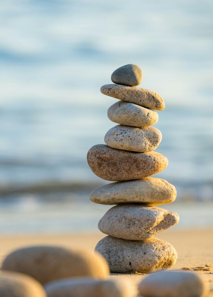 Pebble tower balance harmony stones over the beach